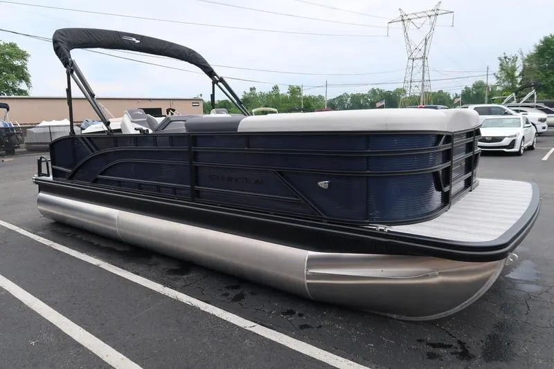 Slide: The Image of 2026 Bennington S Swingback 22 SSB pontoon boat in parking lot, side view. - 5