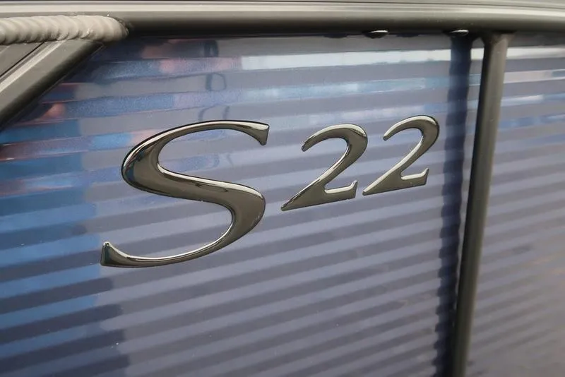 Slide: The Image of Close-up of 2026 Bennington S Swingback 22 SSB logo on blue surface. - 7