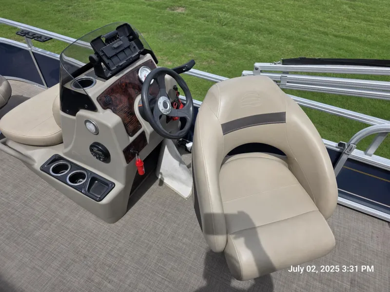 Slide: The Image of 2021 Sun Tracker Bass Buggy 16 XL boat interior with steering console and seating. - 4