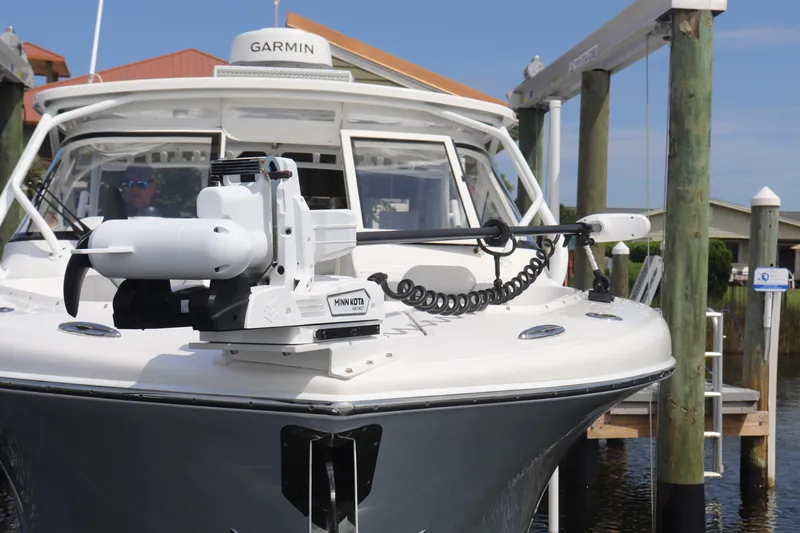 Slide: The Image of 2021 Albemarle 31 DC boat with Minn Kota motor and Garmin equipment at dock. - 10