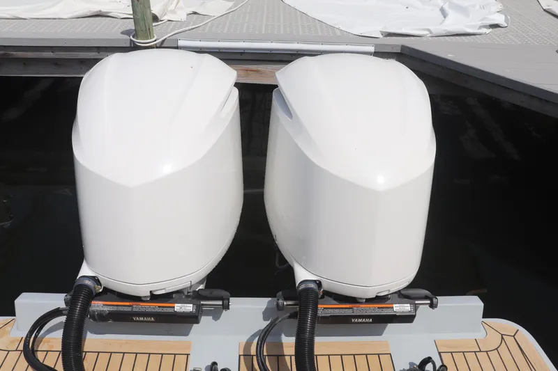 Slide: The Image of Twin Yamaha outboard engines on a 2021 Albemarle 31 DC boat at a dock. - 11