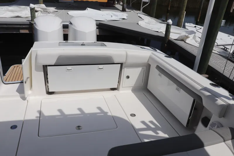 Slide: The Image of 2021 Albemarle 31 DC boat interior with storage compartments and seating area. - 17