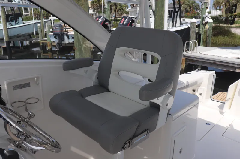 Slide: The Image of Captain's chair on 2021 Albemarle 31 DC boat, featuring sleek design and comfortable seating. - 21
