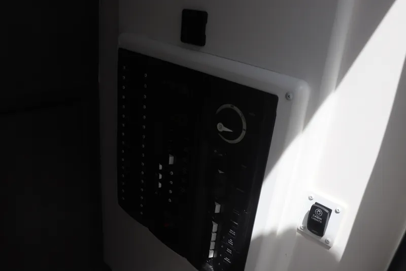 Slide: The Image of Control panel of 2021 Albemarle 31 DC boat, featuring switches and a cabin lights button. - 29
