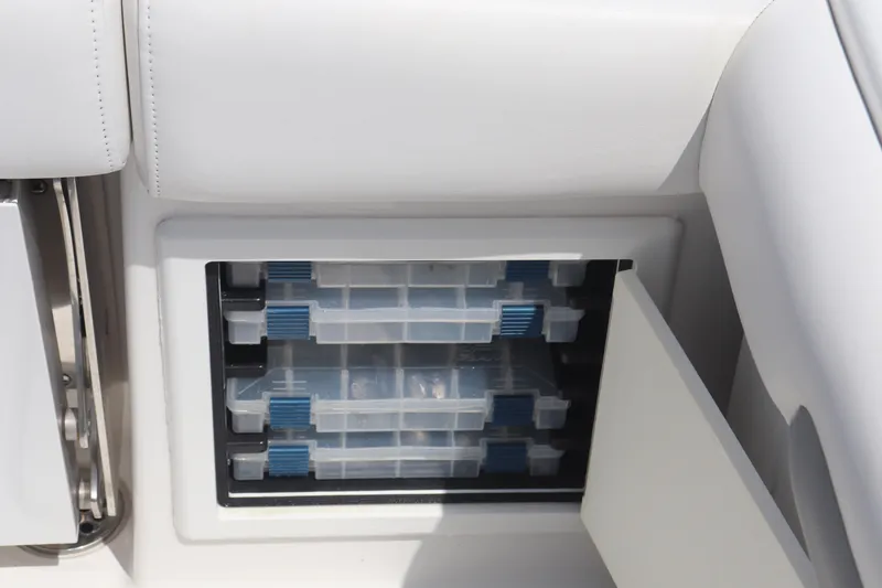Slide: The Image of Storage compartment with tackle boxes on a 2021 Albemarle 31 DC boat. - 34