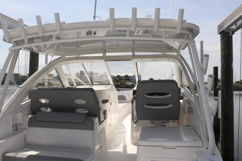 Slide: The Image of 2021 Albemarle 31 DC boat interior with seating and helm station. - 36
