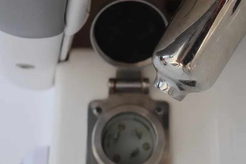 Slide: The Image of Close-up of a 2021 Albemarle 31 DC boat's metallic fixture and socket. - 38