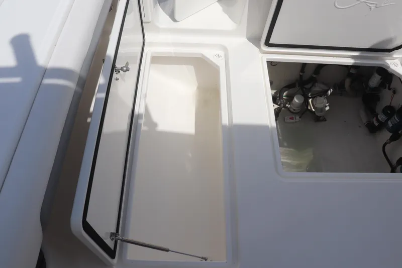Slide: The Image of Open storage compartments on a 2021 Albemarle 31 DC boat deck. - 46