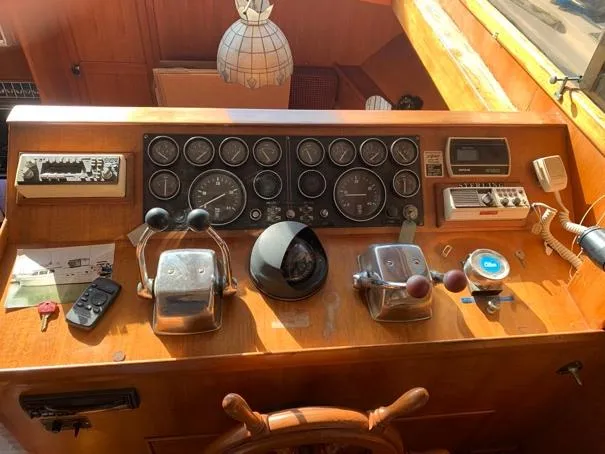 Slide: The Image of Control panel of a 1984 CHB 48 boat with gauges and navigation equipment. - 15