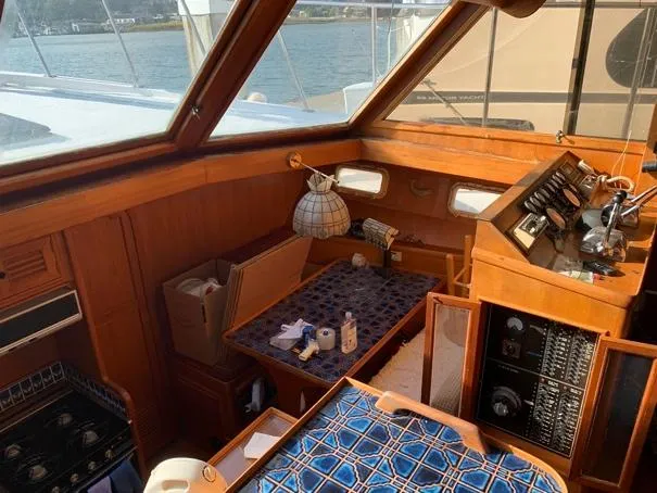 Slide: The Image of Interior of a 1984 CHB 48 boat with wooden furnishings and nautical decor. - 16