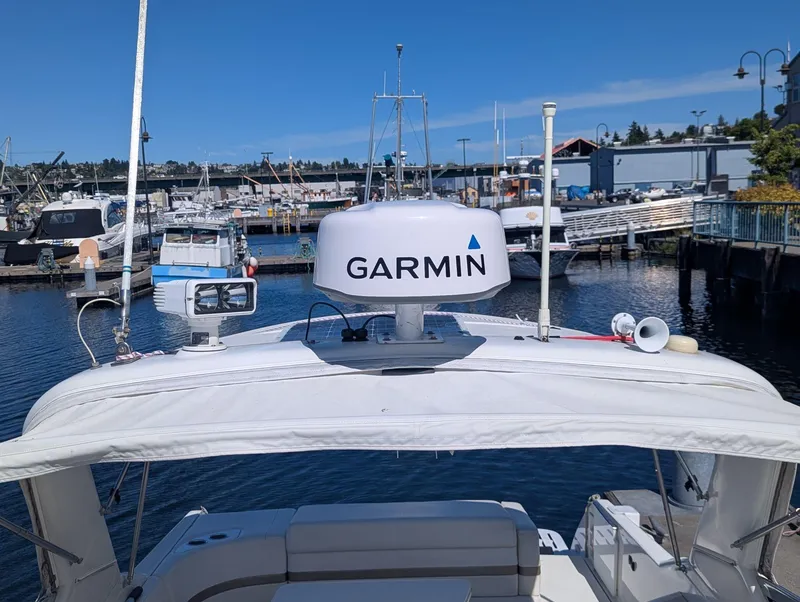 Slide: The Image of 2003 Formula 330 SS boat with Garmin radar at a marina. - 10