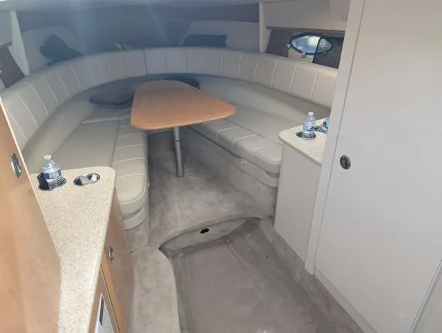 Slide: The Image of Interior of 2003 Formula 330 SS boat with seating and table. - 12