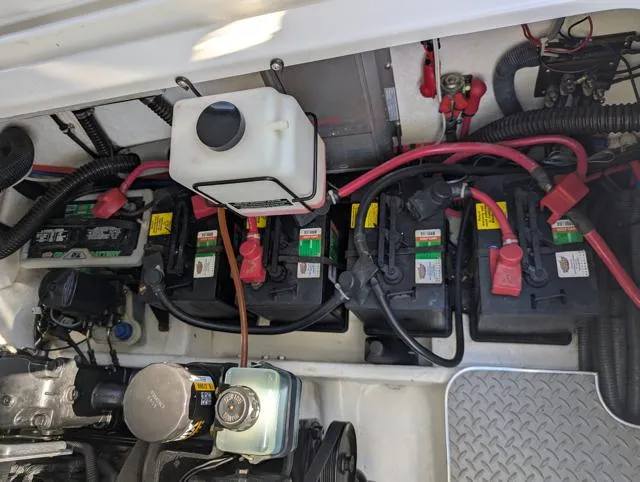 Slide: The Image of Engine compartment of a 2003 Formula 330 SS with multiple batteries and wiring. - 15