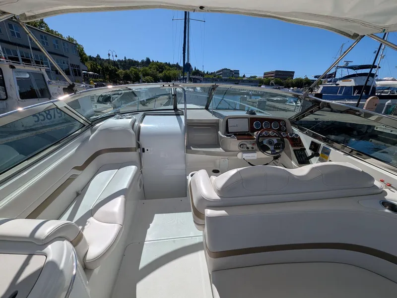 Slide: The Image of Interior view of a 2003 Formula 330 SS boat, featuring a sleek cockpit and seating area. - 7