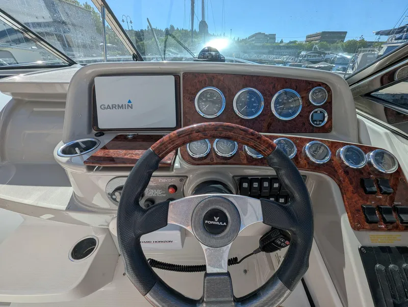 Slide: The Image of Dashboard of a 2003 Formula 330 SS boat with Garmin navigation system. - 9
