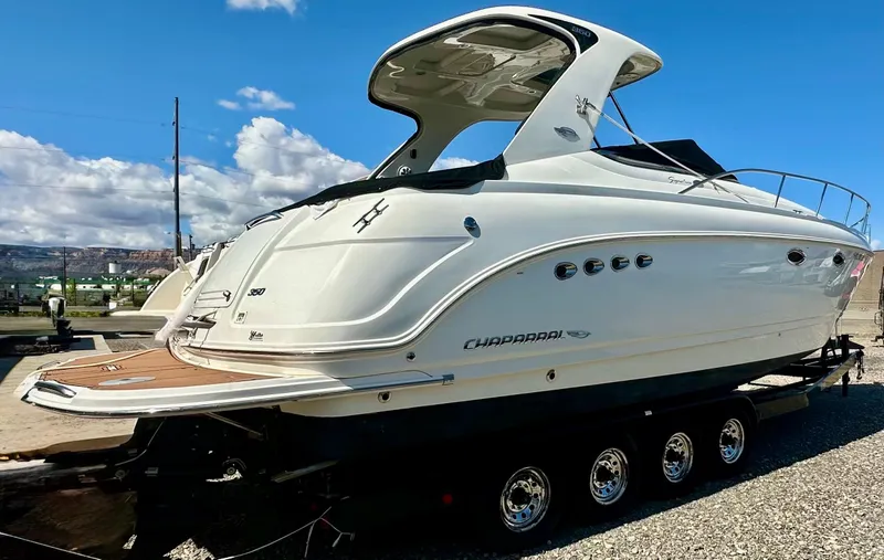 Slide: The Image of 2008 Chaparral 350 Signature boat on trailer under clear blue sky. - 1