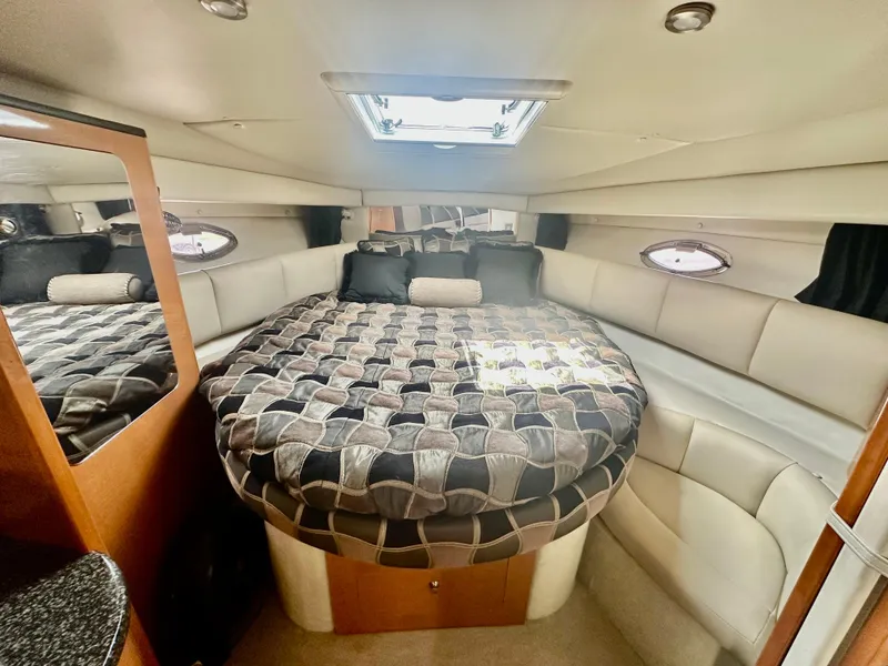 Slide: The Image of Luxurious interior cabin of 2008 Chaparral 350 Signature yacht with cozy bed. - 11