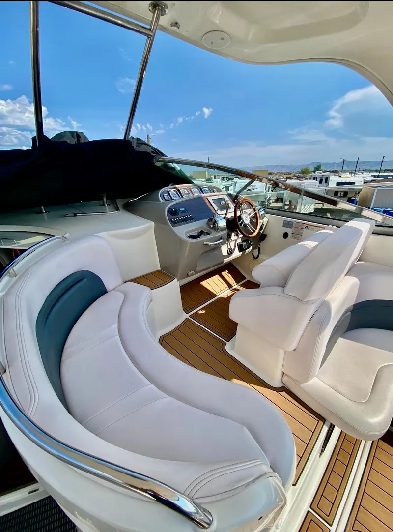 Slide: The Image of 2008 Chaparral 350 Signature boat interior with white seating and wooden flooring. - 3