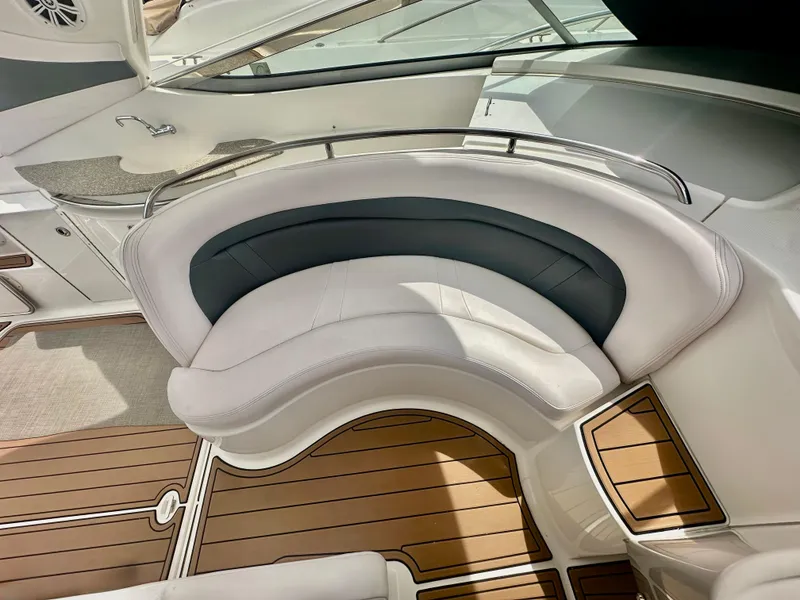 Slide: The Image of 2008 Chaparral 350 Signature yacht interior with curved seating and wood flooring. - 4