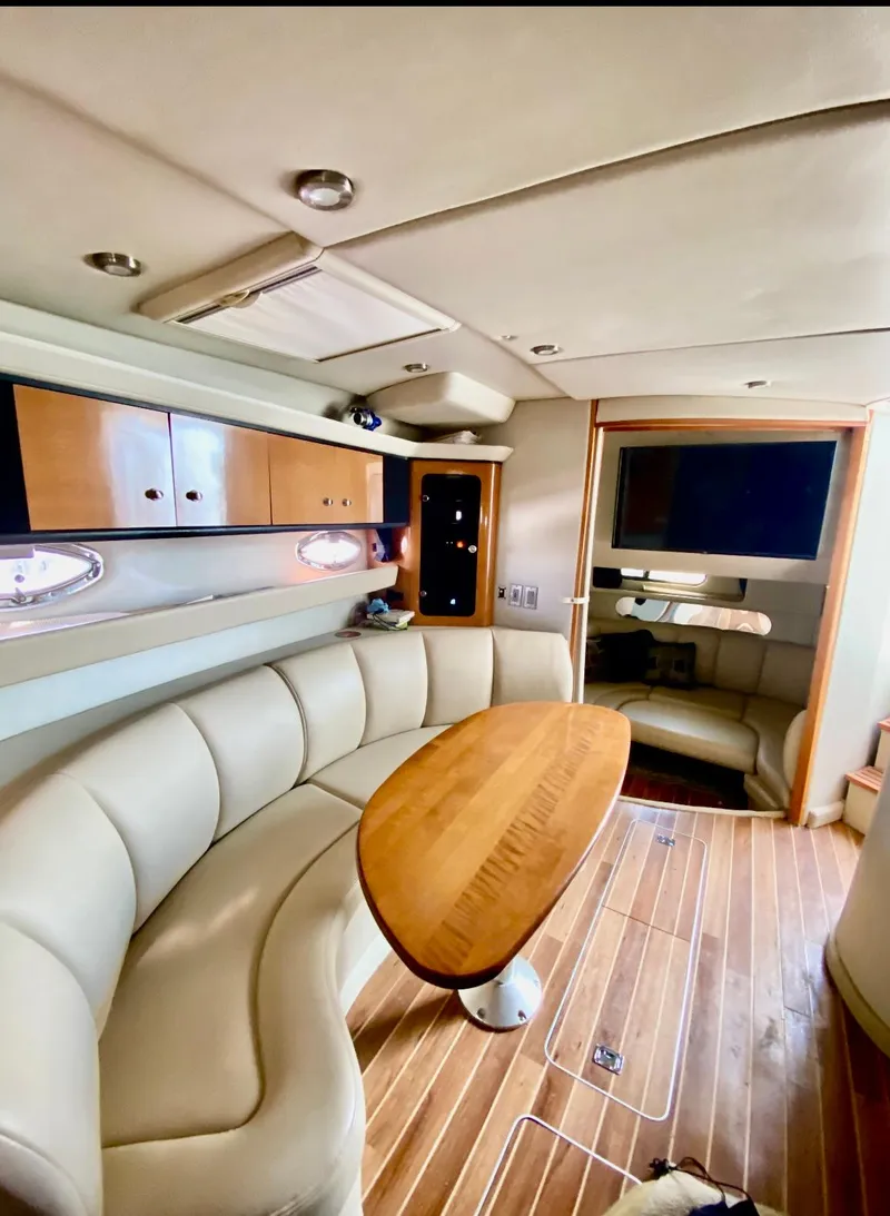 Slide: The Image of Luxurious interior of 2008 Chaparral 350 Signature yacht with elegant seating and wooden table. - 8