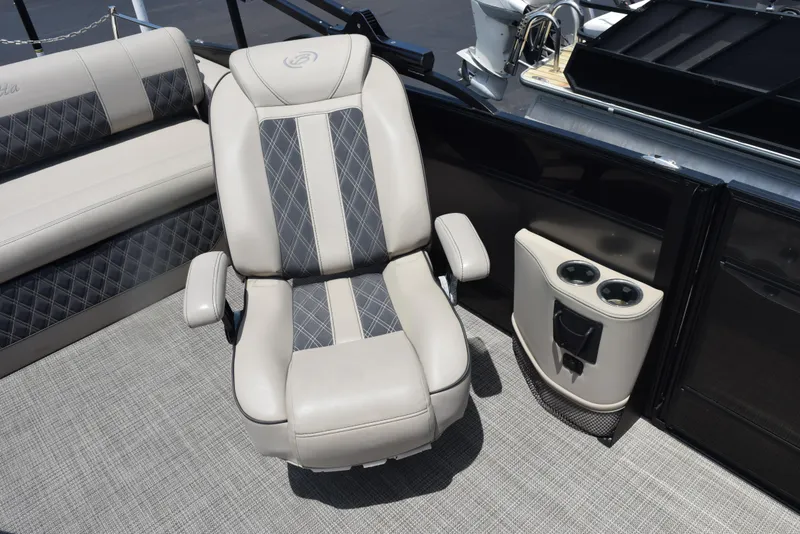 Slide: The Image of 2022 Barletta L25UC boat interior with luxurious seating and cup holders. - 11