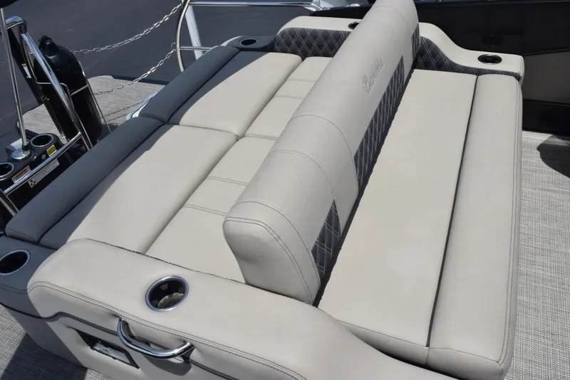 Slide: The Image of 2022 Barletta L25UC boat seating with beige upholstery and cup holders. - 15