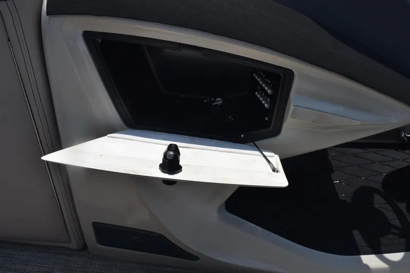 Slide: The Image of Open storage compartment on 2022 Barletta L25UC boat. - 19