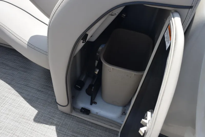 Slide: The Image of 2022 Barletta L25UC boat storage compartment with trash bin. - 20