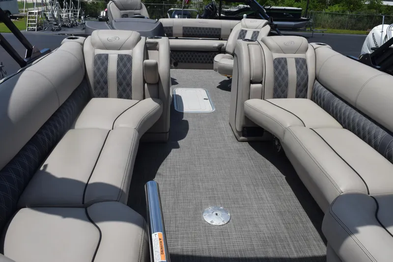 Slide: The Image of 2022 Barletta L25UC pontoon boat interior with luxurious seating and modern design. - 7