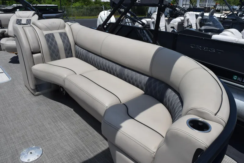 Slide: The Image of 2022 Barletta L25UC pontoon boat with luxurious beige seating and cup holder. - 8