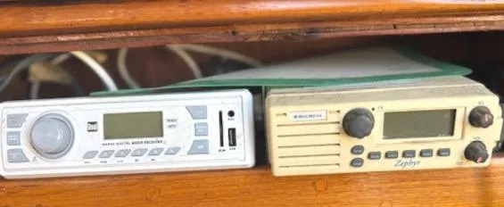 Slide: The Image of Vintage marine radios on a 1979 Lancer Sloop, featuring digital and analog controls. - 20