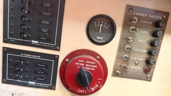 Slide: The Image of Control panel of a 1979 Lancer Sloop yacht with switches and voltmeter. - 25