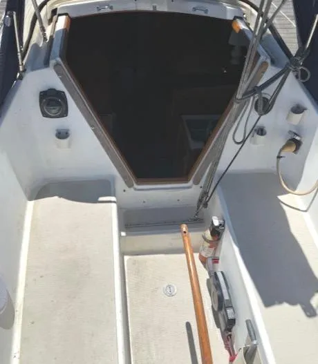 Slide: The Image of 1979 Lancer Sloop cockpit with open cabin entrance and nautical equipment. - 9