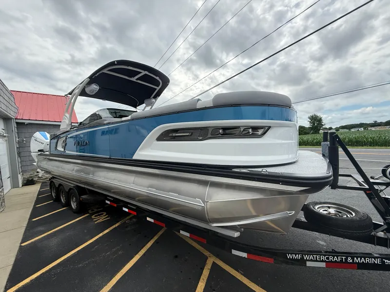 Slide: The Image of 2025 Avalon 2785 Excalibur LTD ELW tri-toon boat with twin Mercury Racing 500R engines. - 11