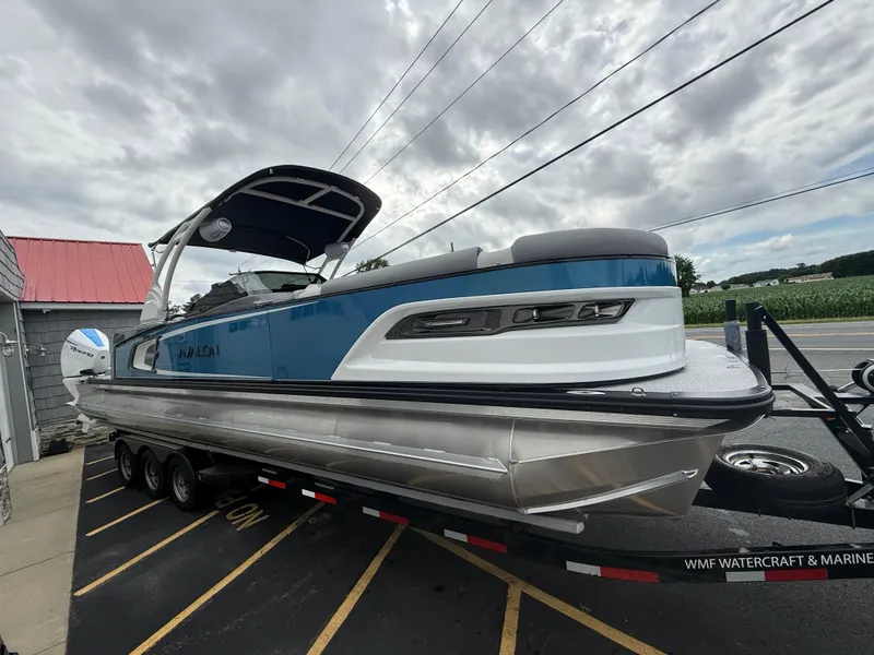 Slide: The Image of 2025 Avalon 2785 Excalibur LTD ELW tri-toon boat with twin Mercury Racing 500R engines. - 12