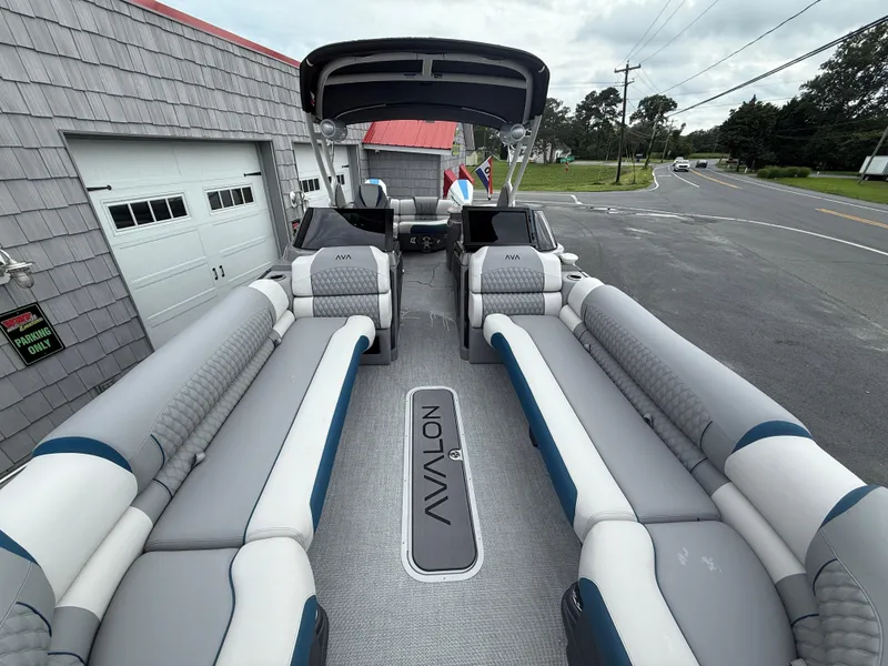Slide: The Image of 2025 Avalon 2785 Excalibur LTD ELW pontoon boat with luxurious seating and joystick controls. - 13