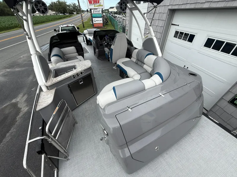Slide: The Image of 2025 Avalon 2785 Excalibur LTD ELW pontoon boat with luxurious seating and modern amenities. - 15