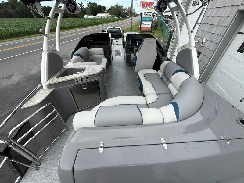 Slide: The Image of 2025 Avalon 2785 Excalibur LTD ELW pontoon boat with luxurious seating and modern controls. - 16