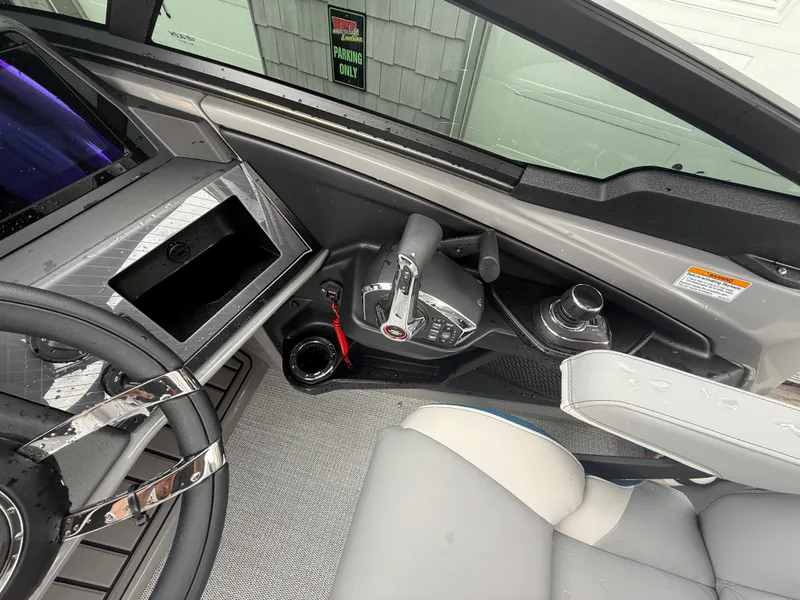 Slide: The Image of 2025 Avalon 2785 Excalibur LTD ELW boat cockpit with joystick controls and steering wheel. - 28