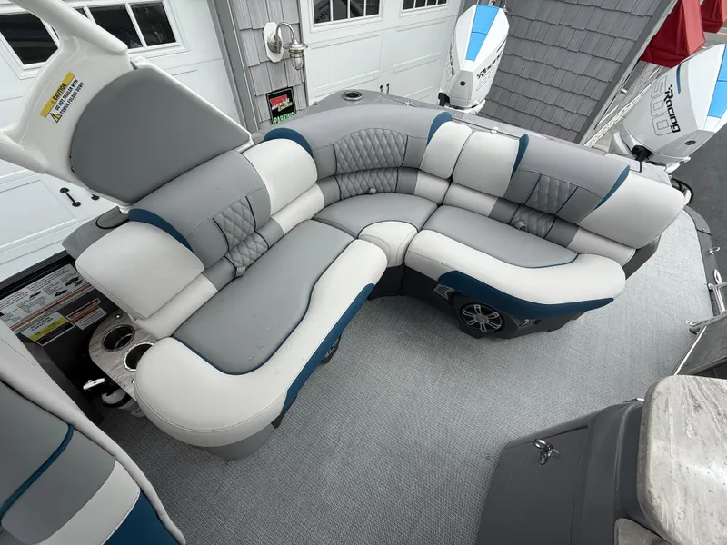 Slide: The Image of Luxurious seating on 2025 Avalon 2785 Excalibur LTD ELW tri-toon boat with twin Mercury Racing engines. - 32