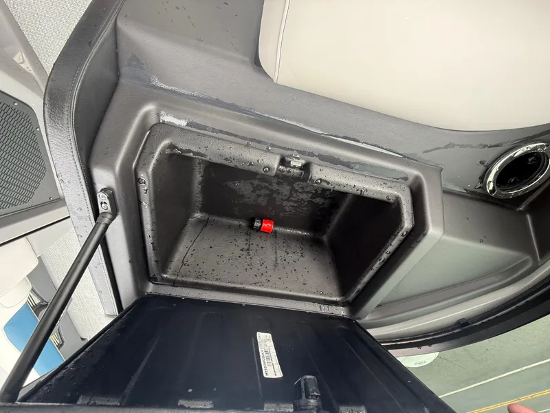 Slide: The Image of Open storage compartment in 2025 Avalon 2785 Excalibur LTD ELW boat, showing interior details. - 35