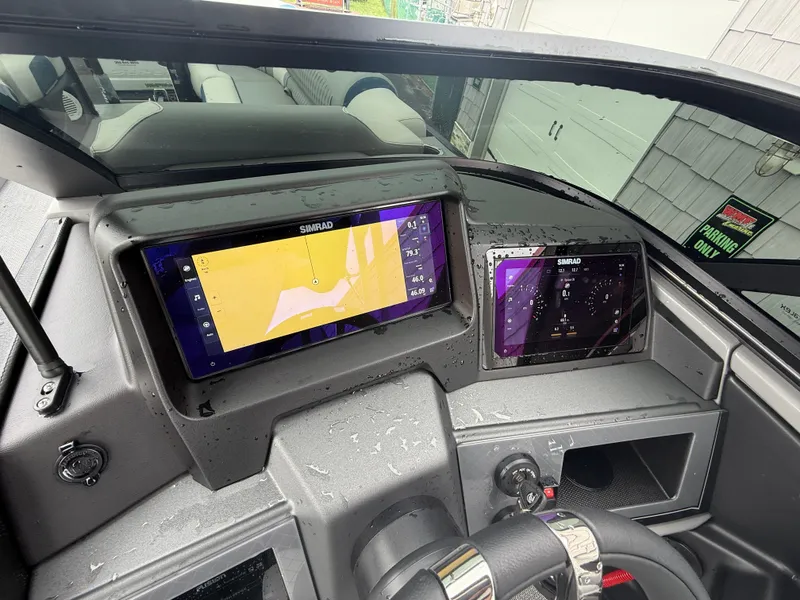 Slide: The Image of Dashboard of 2025 Avalon 2785 Excalibur LTD ELW with Simrad navigation displays. - 38