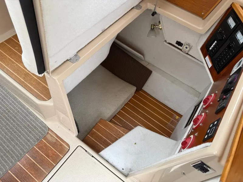 Slide: The Image of 2016 Cutwater 288 C cabin interior with wood flooring and control panel. - 16
