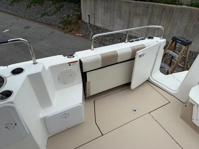 Slide: The Image of 2016 Cutwater 288 C boat deck with open door and storage compartments. - 17