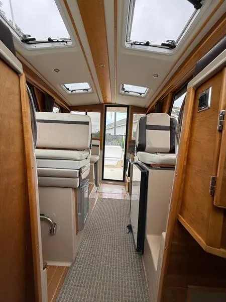 Slide: The Image of Interior of 2016 Cutwater 288 C boat, featuring seating and skylights. - 20