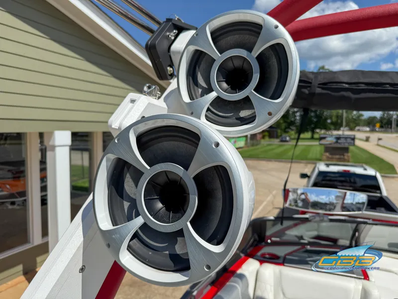 Slide: The Image of 2021 Malibu M240 boat speakers with sleek design, mounted on a red frame. - 28