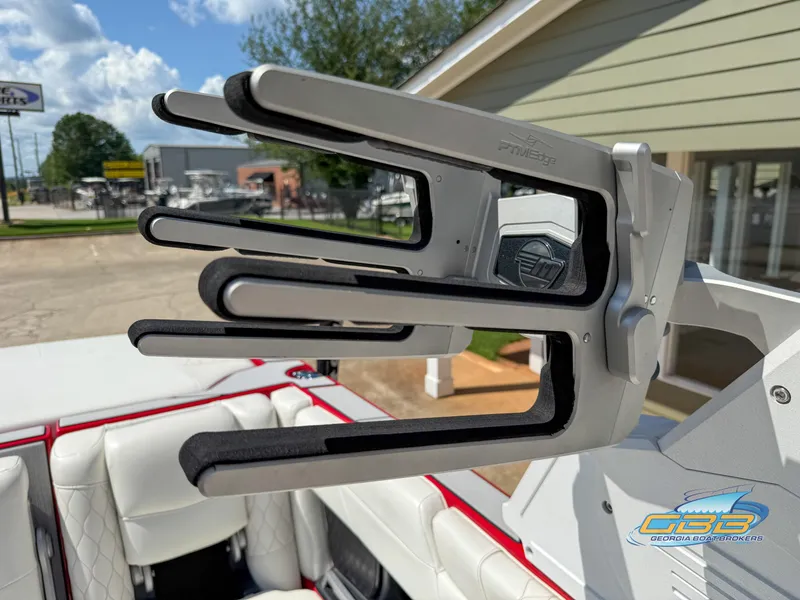 Slide: The Image of 2021 Malibu M240 boat with a PrmEdge wakeboard rack, white and red interior. - 29