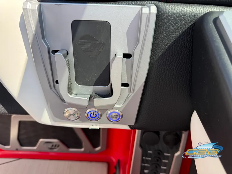 Slide: The Image of Control panel of a 2021 Malibu M240 boat with power and start buttons. - 34