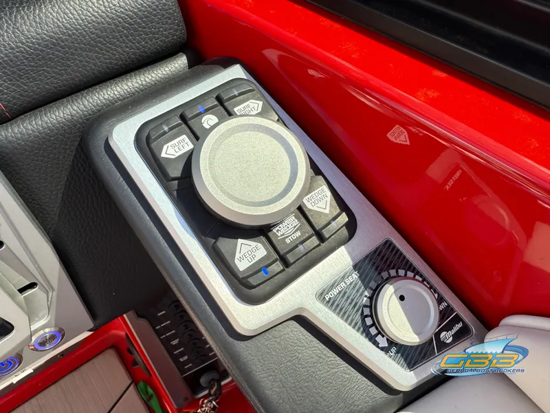 Slide: The Image of Control panel of a 2021 Malibu M240 boat with surf and wedge adjustments. - 35