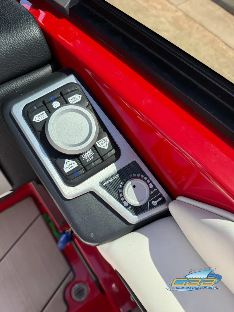 Slide: The Image of Control panel of a 2021 Malibu M240 boat with various adjustment knobs. - 38